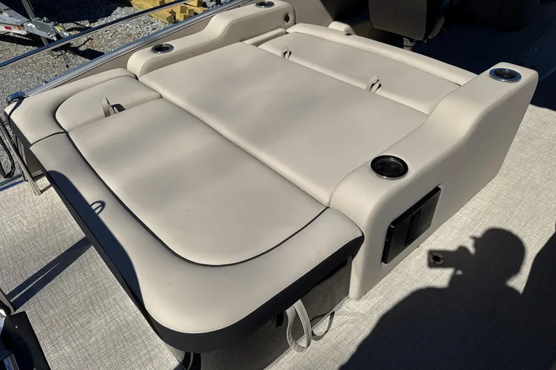 Slide: The Image of 2026 Tahoe Pontoon Cascade Versatile Rear Bench 23 with beige upholstery and cup holders. - 5
