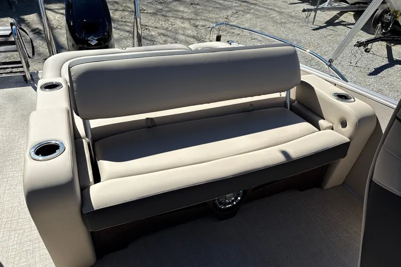 Slide: The Image of 2026 Tahoe Pontoon Cascade Versatile Rear Bench 23 with beige seating and cup holders. - 6