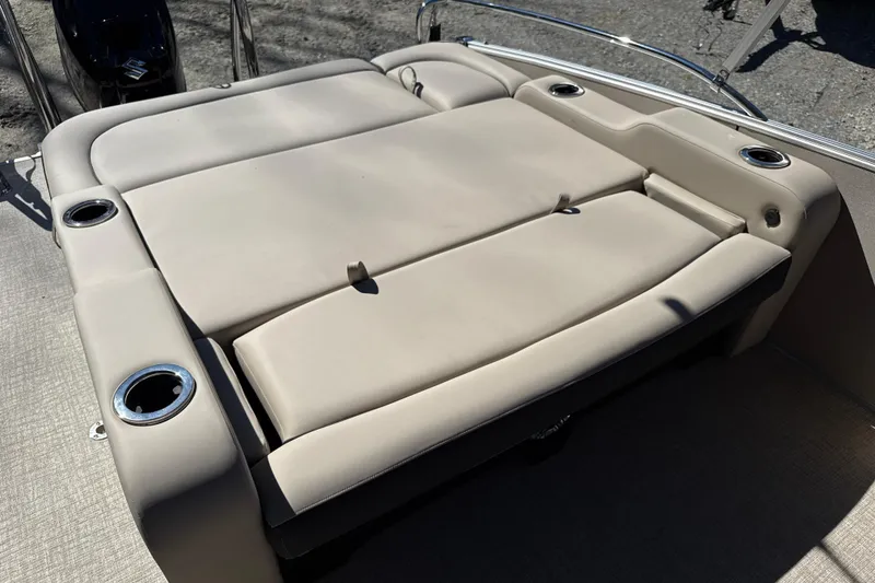 Slide: The Image of 2026 Tahoe Pontoon Cascade Versatile Rear Bench 23 with beige seating and cup holders. - 8