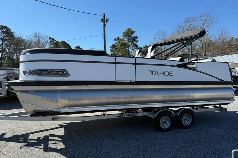 Slide: The Image of 2026 Tahoe Pontoon Cascade VRL 23' on trailer, parked outdoors. - 1