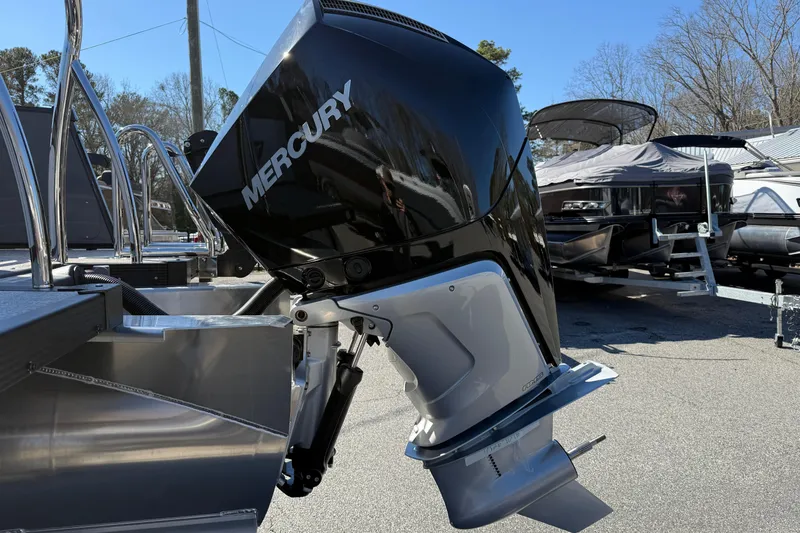 Slide: The Image of 2026 Tahoe Pontoon Cascade VRL with Mercury outboard motor in a marina setting. - 14