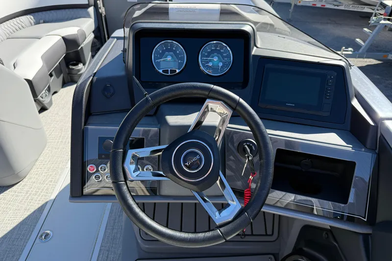 Slide: The Image of Steering console of 2026 Tahoe Pontoon Cascade VRL - 23' with modern gauges and controls. - 6
