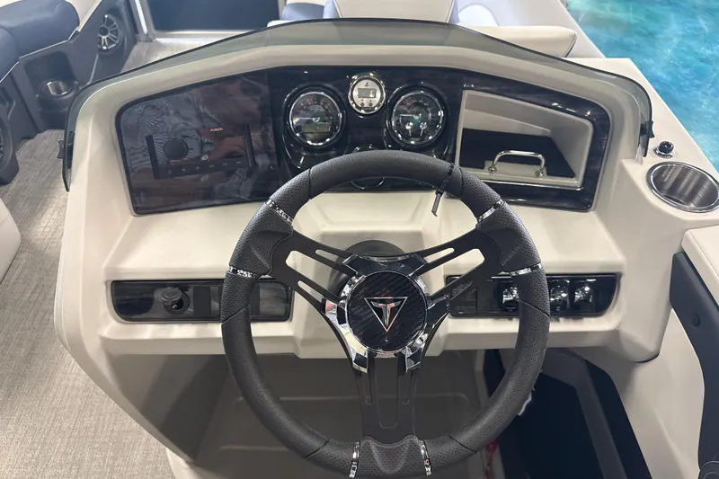 Slide: The Image of 2026 Tahoe Pontoon LTZ Quad Lounger dashboard with steering wheel and controls. - 10