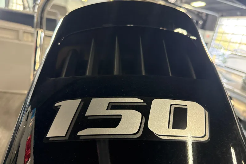 Slide: The Image of Close-up of a 150 horsepower engine on a 2026 Tahoe Pontoon LTZ Quad Lounger. - 3