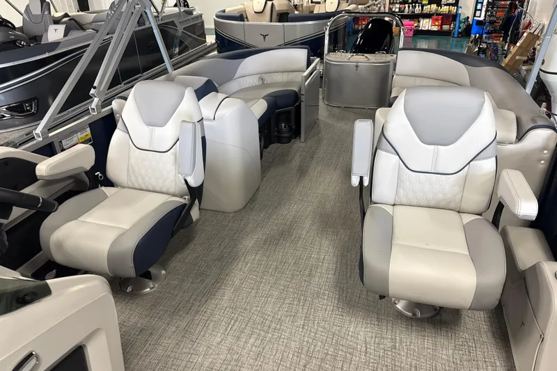 Slide: The Image of 2026 Tahoe Pontoon LTZ Quad Lounger interior with luxurious seating and modern design. - 8