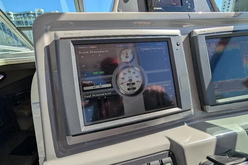 Slide: The Image of Dashboard of a 2014 Robalo R305 Walkaround boat with Garmin GPS display. - 21
