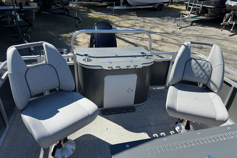 Slide: The Image of 2026 Tahoe Pontoon Sport 85 Rear Fish with dual gray seats and fishing station. - 10