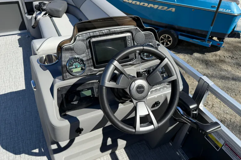Slide: The Image of Steering console of 2026 Tahoe Pontoon Sport 85 Rear Fish boat, featuring modern controls. - 5