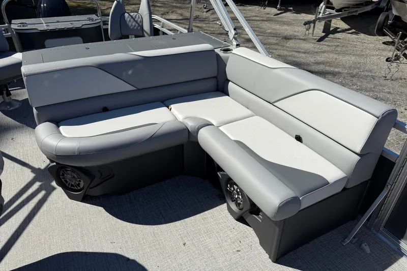Slide: The Image of 2026 Tahoe Pontoon Sport 85 Rear Fish boat with gray seating and modern design. - 6