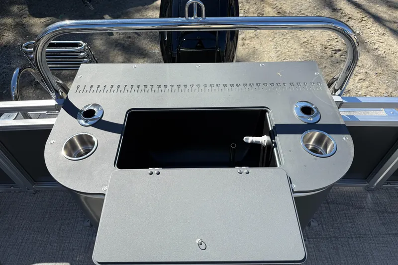 Slide: The Image of 2026 Tahoe Pontoon Sport 85 Rear Fish fishing station with cup holders and storage compartment. - 7