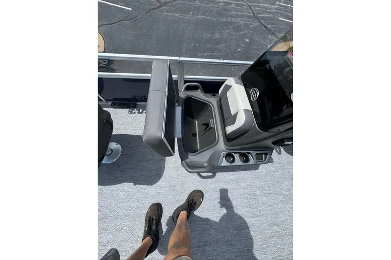 Slide: The Image of 2026 Sun Tracker Bass Buggy 18 DLX interior with seating and console, viewed from above. - 12
