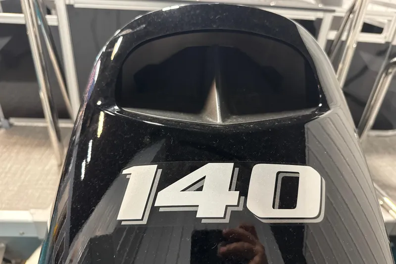 Slide: The Image of Close-up of a 140 horsepower engine on a 2026 Tahoe Pontoon Sport 85 Rear Fish. - 10