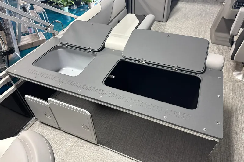 Slide: The Image of 2026 Tahoe Pontoon Sport 85 Rear Fish with open storage compartments and seating. - 8