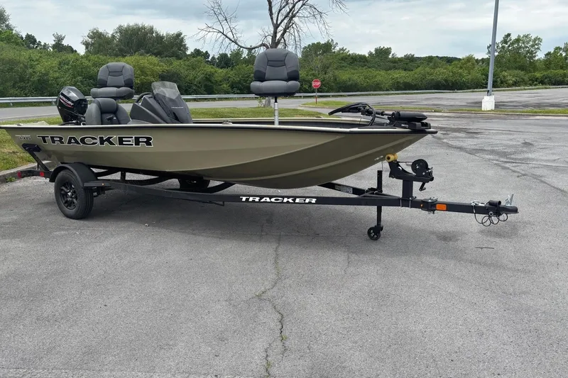 The Image of 2026 Tracker Pro Team 175 boat on trailer in parking lot. - 0