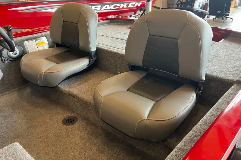Slide: The Image of 2026 Tracker Pro 170 boat interior with two gray seats and red accents. - 2