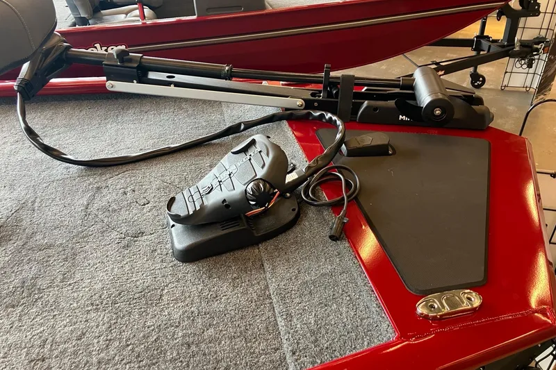 Slide: The Image of 2026 Tracker Pro 170 boat deck with trolling motor and foot pedal controls. - 4
