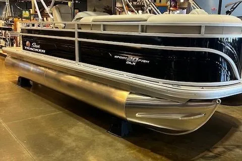 Slide: The Image of 2026 Sun Tracker SportFish 20 DLX pontoon boat displayed indoors, showcasing sleek design. - 99