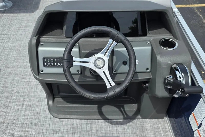 Slide: The Image of 2026 Sun Tracker SportFish 20 DLX steering console with modern controls and cup holder. - 4