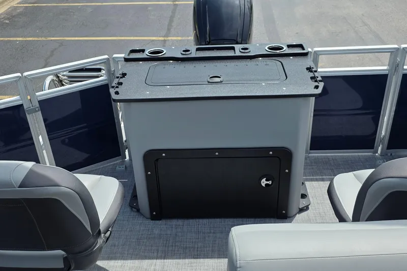 Slide: The Image of 2026 Sun Tracker SportFish 20 DLX boat interior with seating and storage compartment. - 8