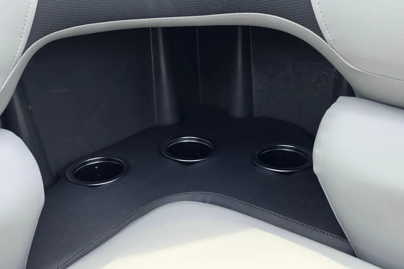 Slide: The Image of Interior of 2026 Sun Tracker SportFish 20 DLX with three cup holders. - 5