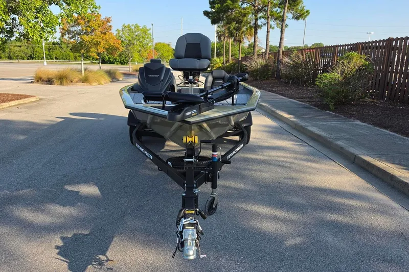 Slide: The Image of 2026 Tracker Pro Team 195 boat parked on a sunny street. - 6