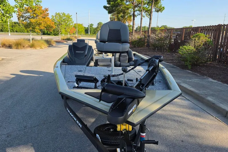 Slide: The Image of 2026 Tracker Pro Team 195 boat parked outdoors, featuring a sleek design and modern equipment. - 5