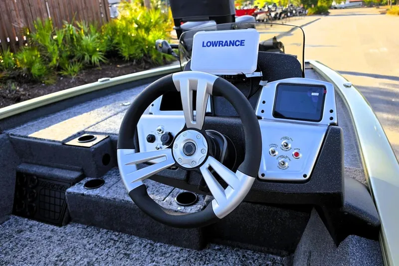 Slide: The Image of Steering console of 2026 Tracker Pro Team 195 boat with Lowrance electronics. - 13
