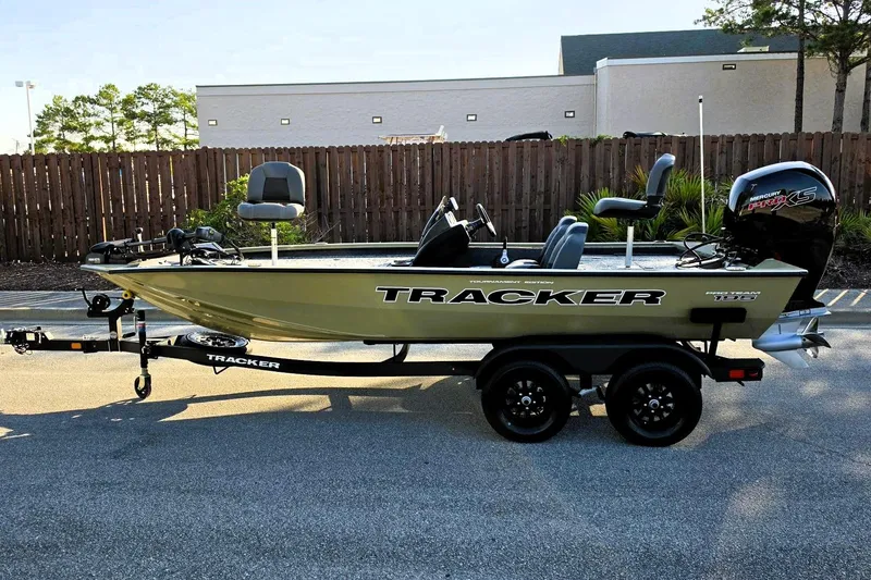 Slide: The Image of 2026 Tracker Pro Team 195 boat on trailer, parked outdoors, featuring Mercury Pro XS engine. - 7