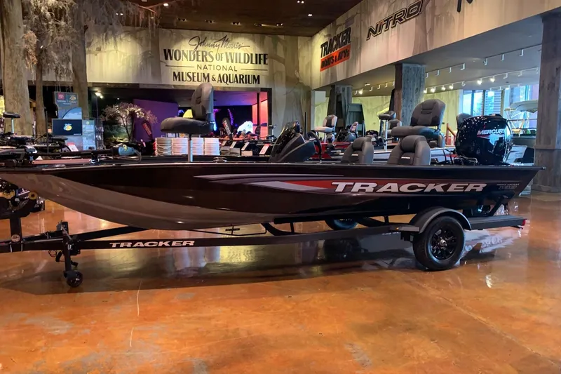 The Image of 2026 Tracker Pro Team 190 boat displayed indoors at a museum and aquarium. - 0