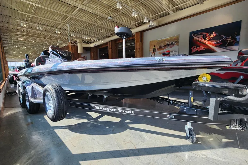 The Image of 2026 Ranger Z519R boat displayed indoors on a Ranger Trail trailer. - 0