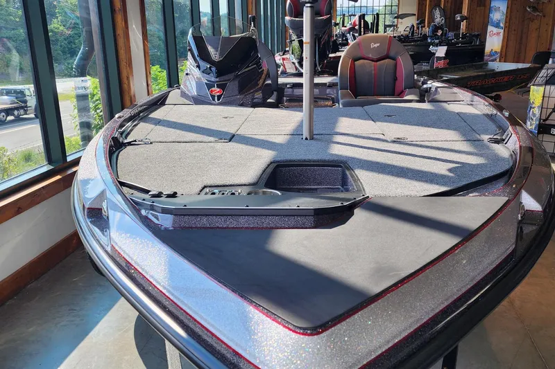 Slide: The Image of 2026 Ranger Z519R boat displayed indoors, featuring sleek design and modern seating. - 2