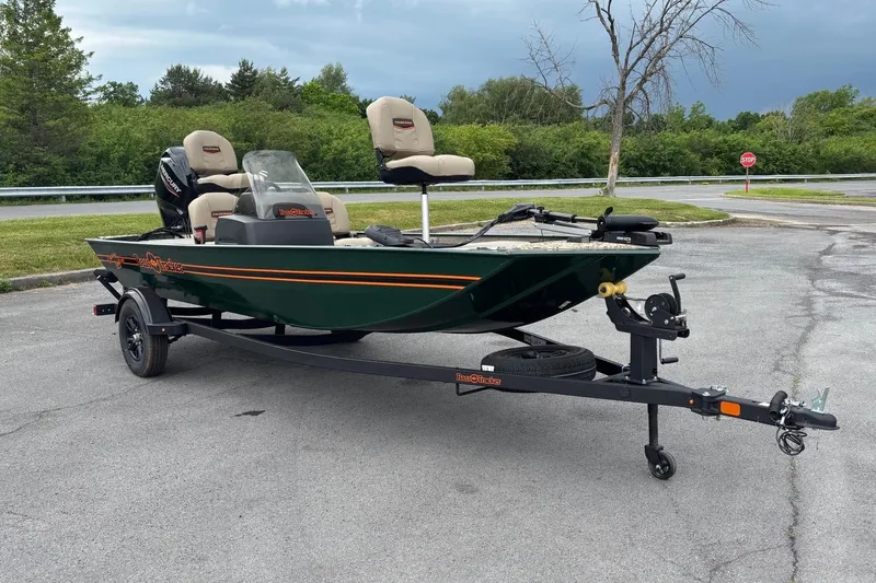 The Image of 2026 Tracker Bass Tracker Classic Limited boat on trailer in parking lot. - 0