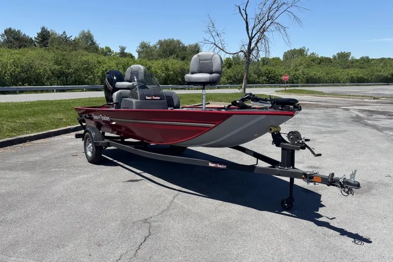 Slide: The Image of 2026 Tracker Bass Tracker Classic XL boat on trailer in parking lot. - 2