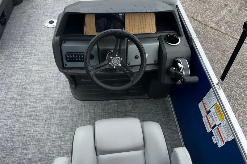 Slide: The Image of Steering console of 2026 Sun Tracker Party Barge 22 RF DLX pontoon boat. - 2