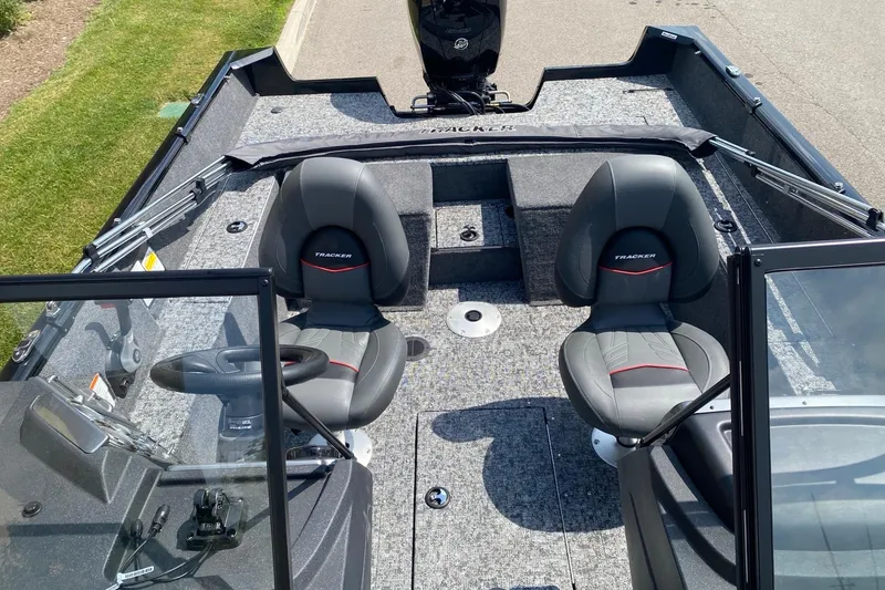Slide: The Image of 2026 Tracker Pro Guide V-175 Combo boat interior with dual seats and steering console. - 7
