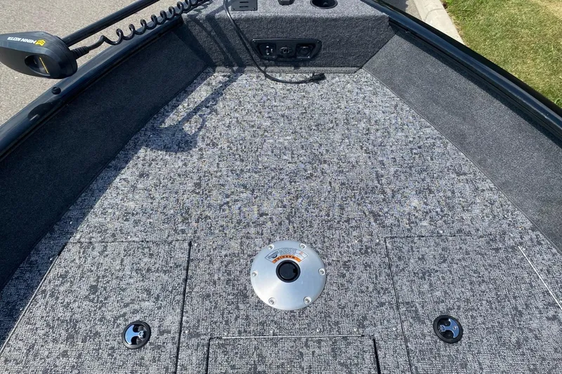 Slide: The Image of 2026 Tracker Pro Guide V-175 Combo boat deck with carpeted surface and fishing seat mount. - 6