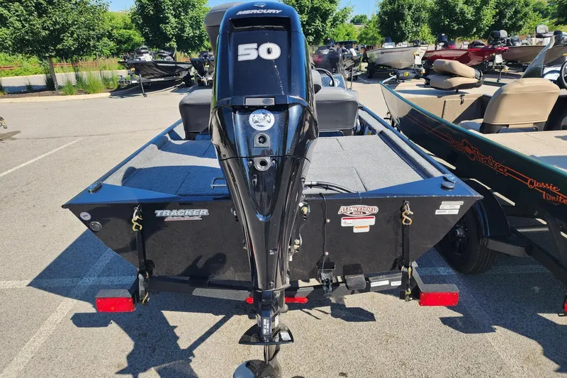 Slide: The Image of 2026 Tracker Bass Tracker Classic XL boat with Mercury 50 engine in a parking lot. - 3