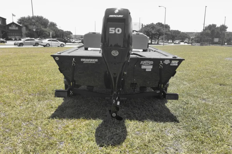 Slide: The Image of 2026 Tracker Bass Tracker Classic XL boat with Mercury 50 engine on grass. - 5