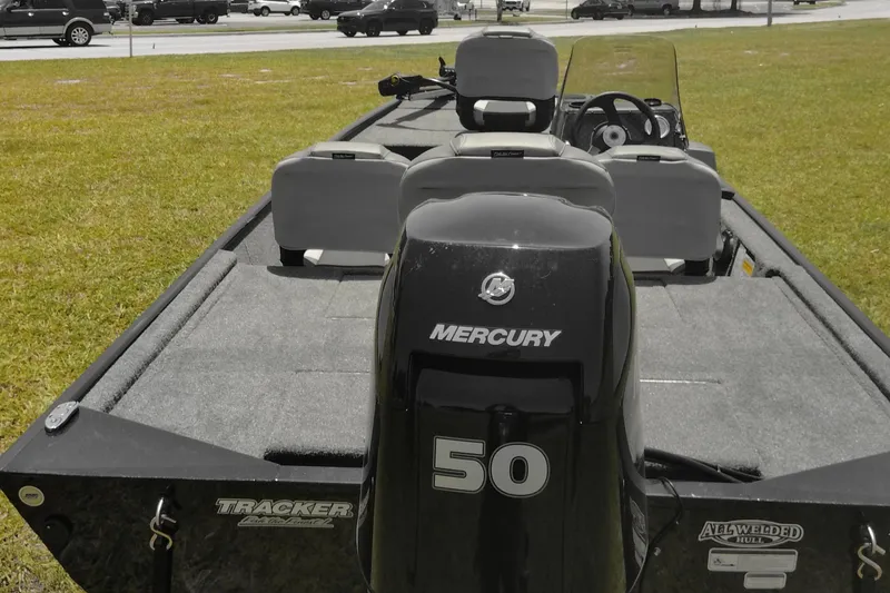 Slide: The Image of 2026 Tracker Bass Tracker Classic XL boat with Mercury 50 engine on grassy area. - 6