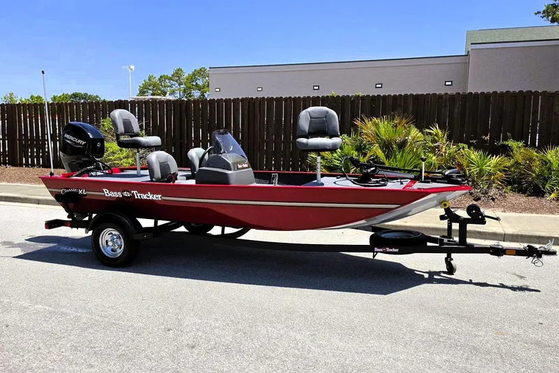 Slide: The Image of 2026 Tracker Bass Tracker Classic XL boat on trailer, parked outdoors. - 4