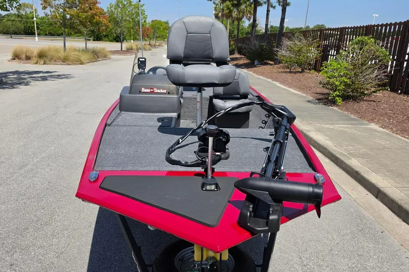 Slide: The Image of 2026 Tracker Bass Tracker Classic XL boat with red trim and gray seating. - 7