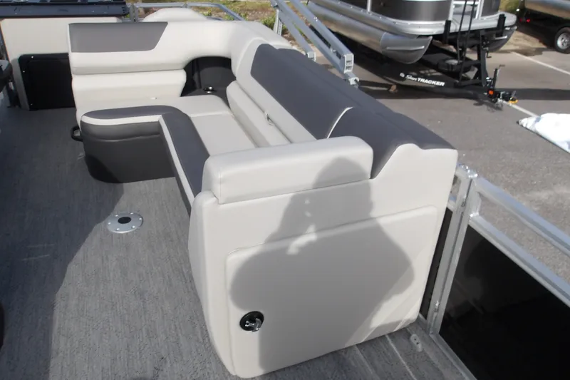 Slide: The Image of 2026 Sun Tracker Fishin' Barge 22 DLX with comfortable seating and modern design. - 27