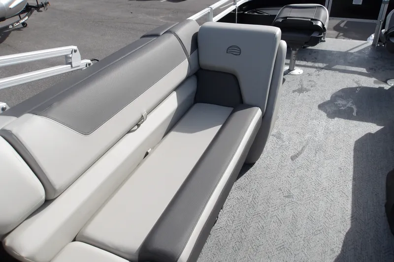 Slide: The Image of 2026 Sun Tracker Fishin' Barge 22 DLX interior with comfortable seating and spacious layout. - 19