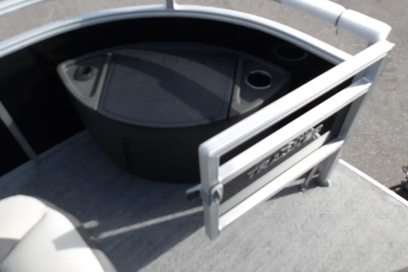 Slide: The Image of 2026 Sun Tracker Fishin' Barge 22 DLX deck with seating and storage area. - 23