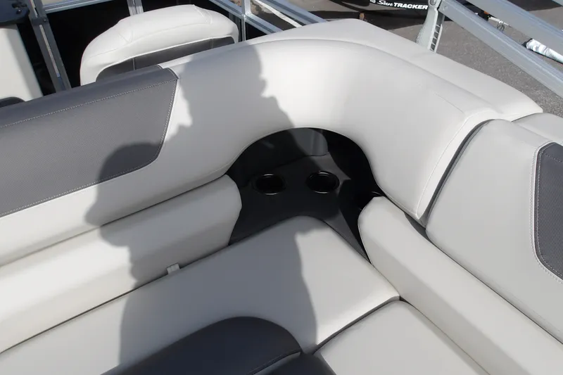 Slide: The Image of Luxurious seating on 2026 Sun Tracker Fishin' Barge 22 DLX with cup holders. - 18