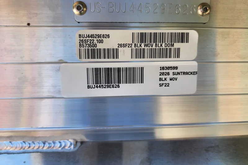 Slide: The Image of 2026 Sun Tracker SportFish 22 DLX identification plate with barcodes and serial numbers. - 84