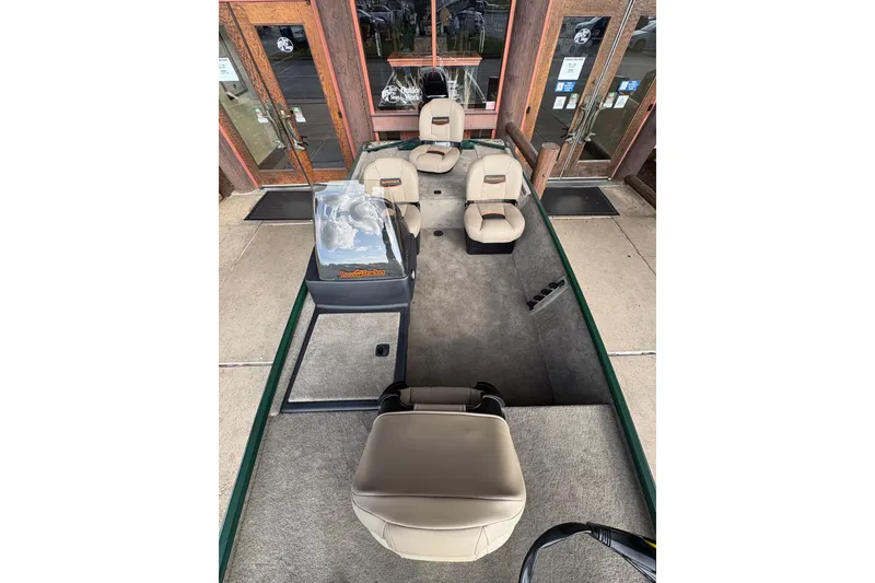 Slide: The Image of 2026 Tracker Bass Tracker Classic Limited boat interior with seating and carpeted floor. - 8