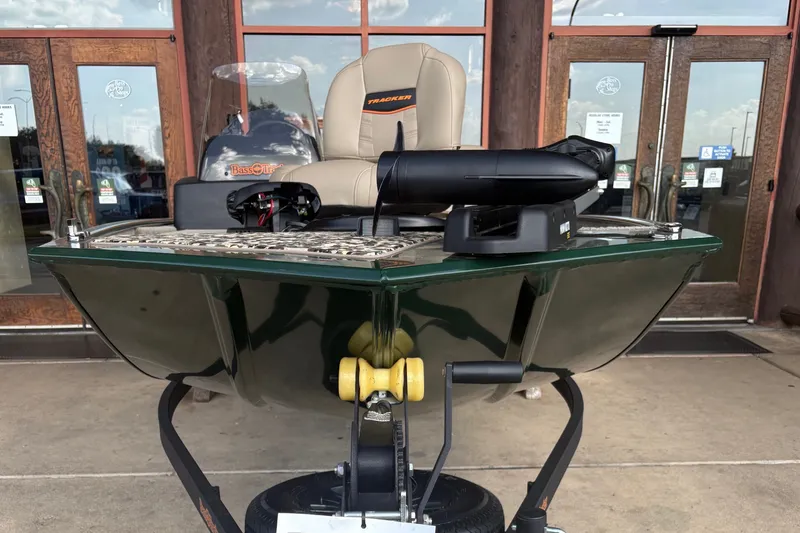 Slide: The Image of A 2026 Tracker Bass Tracker Classic Limited boat on a trailer in front of a building. - 3