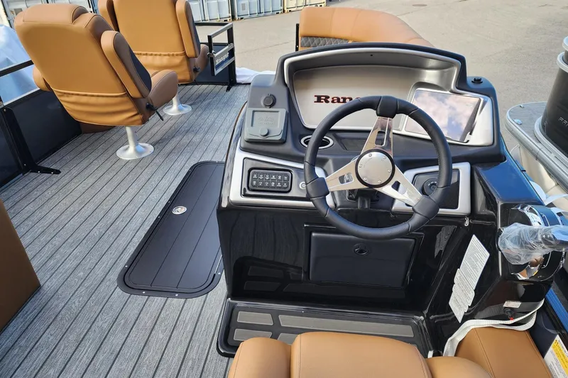 Slide: The Image of Interior of 2026 Ranger 223FC boat with steering wheel and seating. - 3