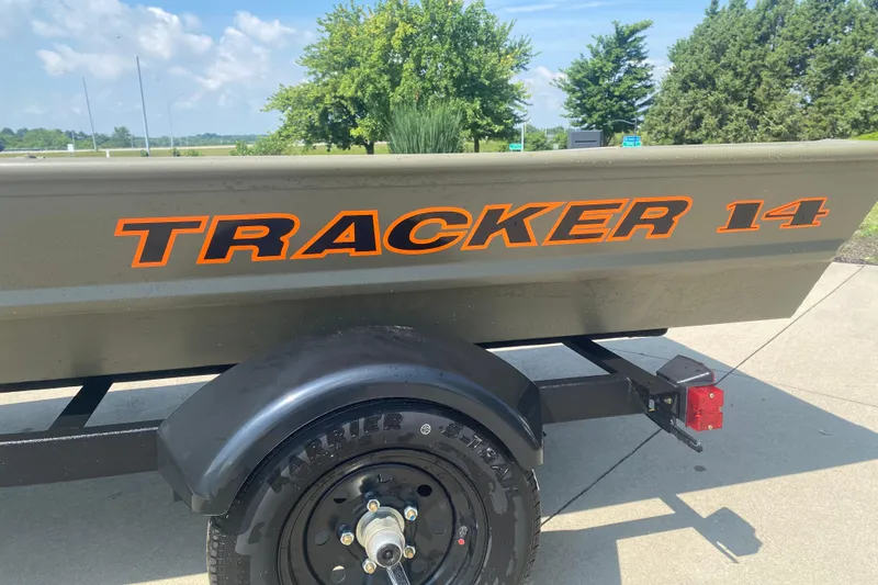 The Image of 2026 Tracker Grizzly 14 Jon boat on trailer, parked outdoors. - 0